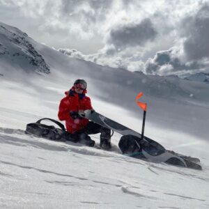 heliski guide glen throwing out a snowboard....jk 